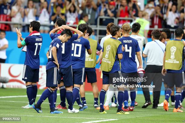 Shinji Kagawa of Japan and teammates look dejected at the end of the 2018 FIFA World Cup Russia Round of 16 match between Belgium and Japan at Rostov...