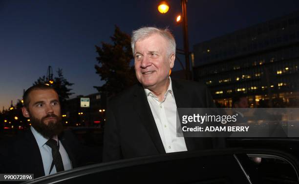 German Interior Minister and leader of the Bavarian Christian Social Union Horst Seehofer gets into his car as he leaves the German Christian...