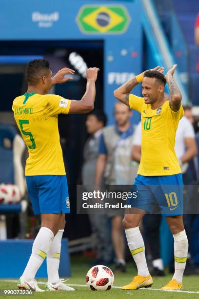 Neymar Jr and Casemiro of Brazil celebrate victory following the 2018 FIFA World Cup Russia Round of 16 match between Brazil and Mexico at Samara...