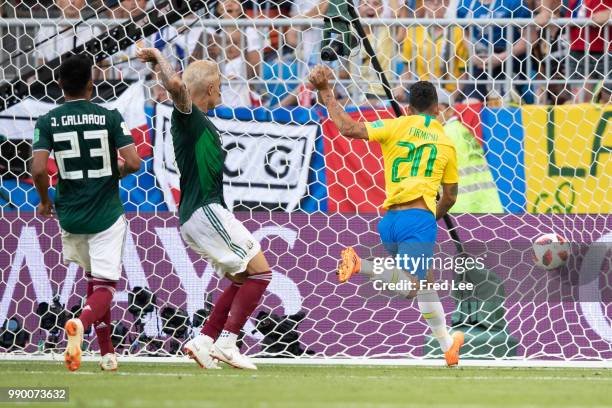 Roberto Firmino of Brazil scores his team's second goal during the 2018 FIFA World Cup Russia Round of 16 match between Brazil and Mexico at Samara...