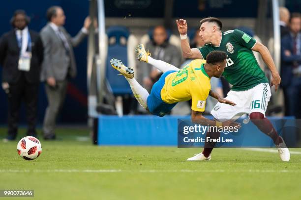 Neymar Jr of Brazil holds off Andres Guardado of Mexico during the 2018 FIFA World Cup Russia Round of 16 match between Brazil and Mexico at Samara...