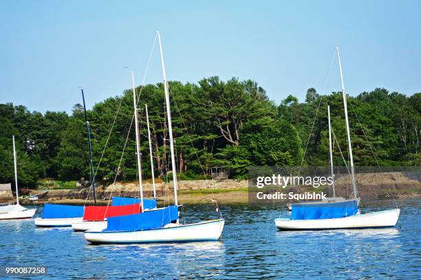 blue boat, red boat - squib stock pictures, royalty-free photos & images
