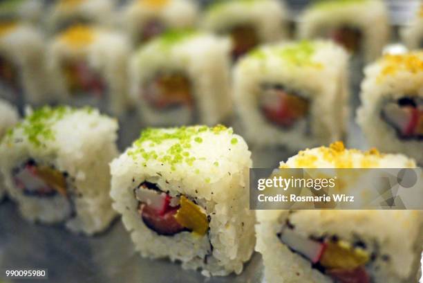 sushi rolls with seafood and vegetables - raw food diet stock pictures, royalty-free photos & images