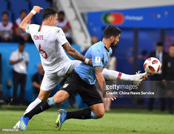 Luis Suarez of Uruguay and Jose Fonte of Portugal vie for the ball during the 2018 FIFA World Cup Russia Round of 16 match between Uruguay and...
