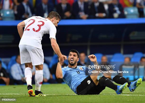 Adrien Silva of Portugal and Luis Suarez of Uruguay in action during the 2018 FIFA World Cup Russia Round of 16 match between Uruguay and Portugal at...