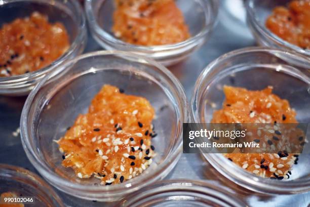 small glass bowls with raw salmon and seeds - raw food diet stock pictures, royalty-free photos & images