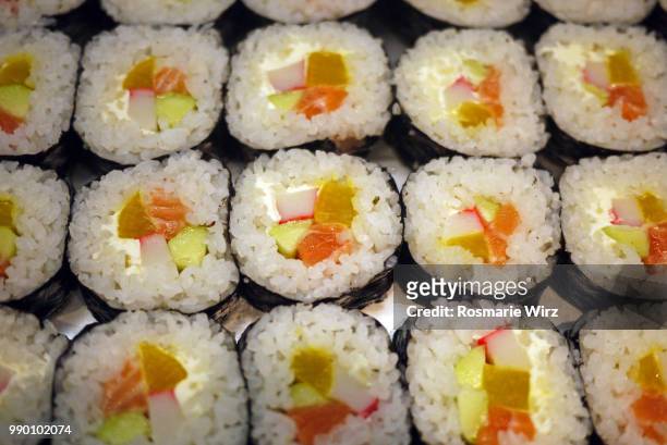 sushi seaweed rolls with seafood and vegetables, full frame - raw food diet stock pictures, royalty-free photos & images