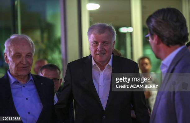 German Interior Minister and leader of the Bavarian Christian Social Union Horst Seehofer talks with former Bavarian State Premier Edmund Stoiber and...