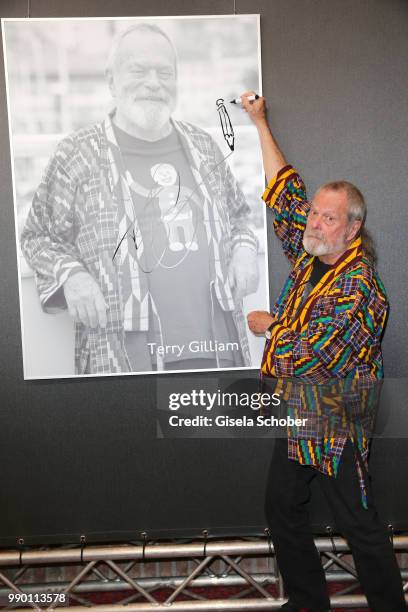 Terry Gilliam signs his photo at CineMerit Award Gala during the Munich Film Festival 2018 at Gasteig on July 2, 2018 in Munich, Germany.