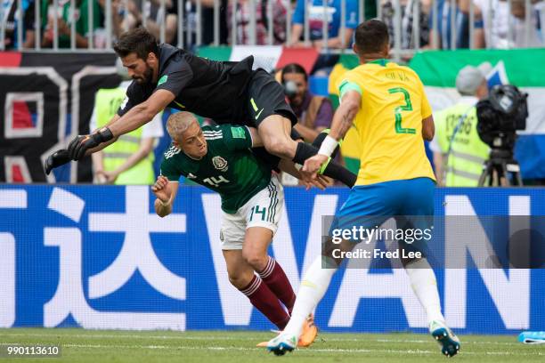 Javier Hernandez of Mexico fights for the ball with Alisson of Brazil during the 2018 FIFA World Cup Russia Round of 16 match between Brazil and...