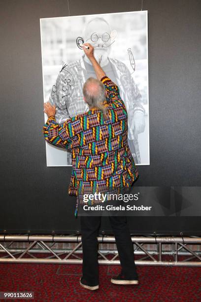 Terry Gilliam signs his photo at CineMerit Award Gala during the Munich Film Festival 2018 at Gasteig on July 2, 2018 in Munich, Germany.