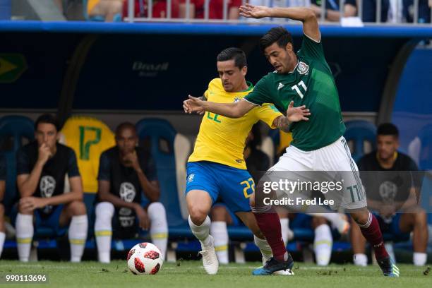 Carlos Vela of Mexico is challenged by Fagner of Brazil during the 2018 FIFA World Cup Russia Round of 16 match between Brazil and Mexico at Samara...