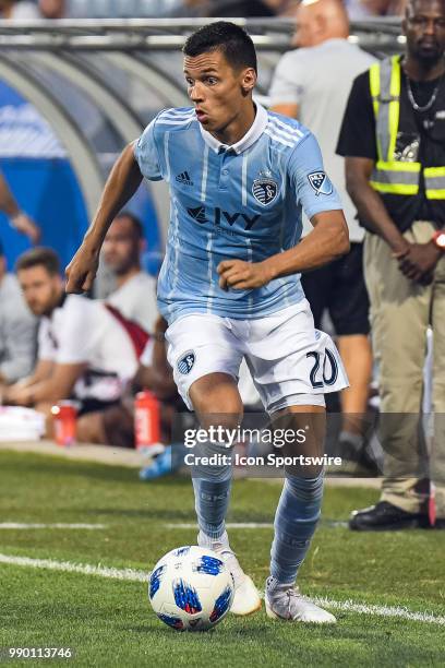 Sporting Kansas City forward Daniel Salloi runs in control of the ball during the Sporting Kansas City versus the Montreal Impact game on June 30 at...