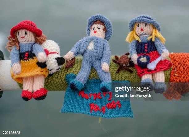 Secretive group of knitters have left their latest display of knitting celebrating Books attached to railings on the Victorian pier on June 30, 2018...
