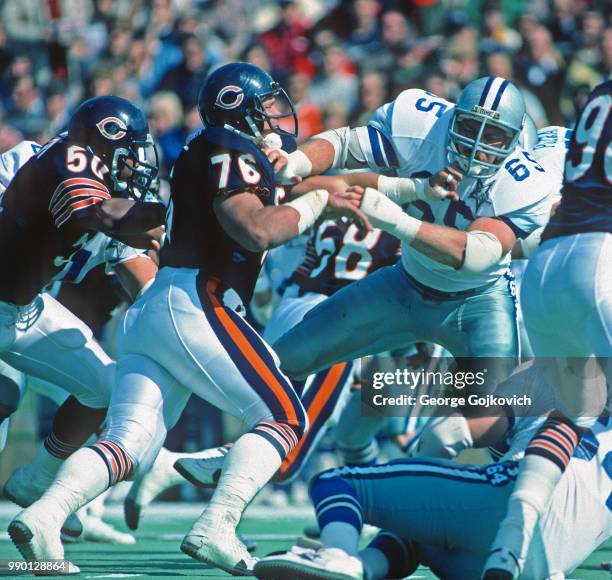 Defensive lineman Steve McMichael of the Chicago Bears battles offensive lineman Kurt Petersen of the Dallas Cowboys at the line of scrimmage during...