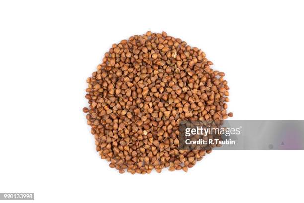 pile of buckwheat seeds isolated over the white background - buckwheat isolated stock pictures, royalty-free photos & images