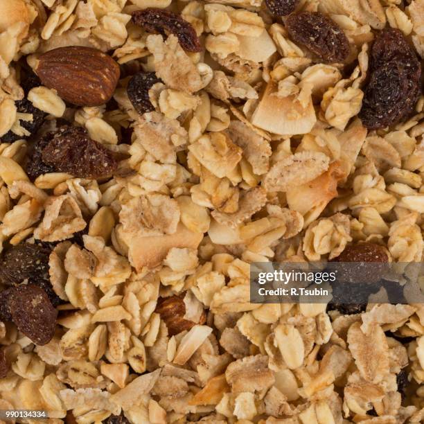 closeup of a pile of muesli cereal breakfast oatmeal - raisin bran stock pictures, royalty-free photos & images