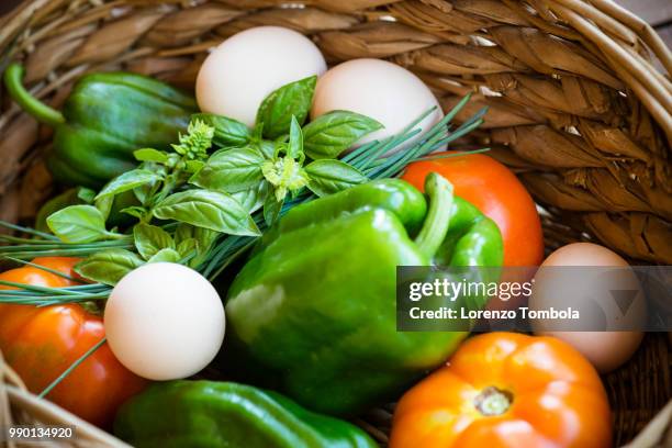 close-up of fresh, organic, healthy vegetable harvest variety in basket with eggs - eggs in basket stock pictures, royalty-free photos & images