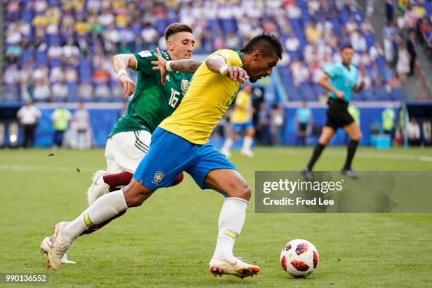 Casemiro of Brazil battles for possession with Hector Herrera of Mexico during the 2018 FIFA World Cup Russia Round of 16 match between Brazil and...