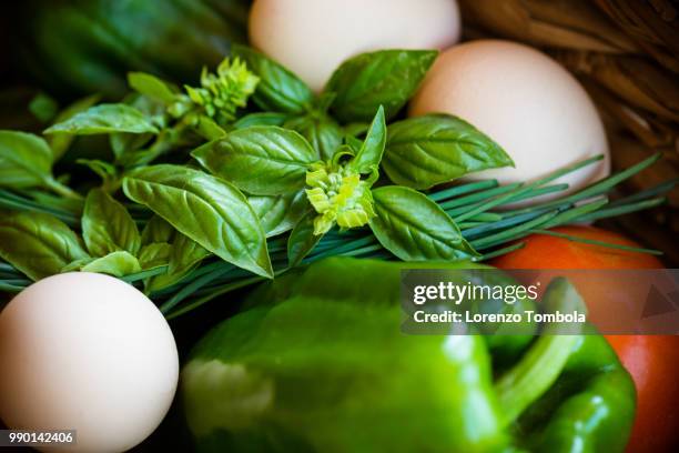 extreme close-up of fresh, organic, healthy vegetable harvest variety in basket with eggs - eggs in basket stock pictures, royalty-free photos & images