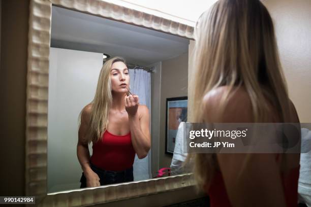 Boxer Mikaela Mayer does her makeup before heading out to the fight week press conference at Chesapeake Energy Arena on June 28, 2018 in Oklahoma...