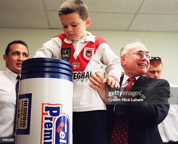 Australian Prime Minister John Howard and a St George Illawarra Dragons fan put together a time capsule at the NRL press conference for the NRL's...