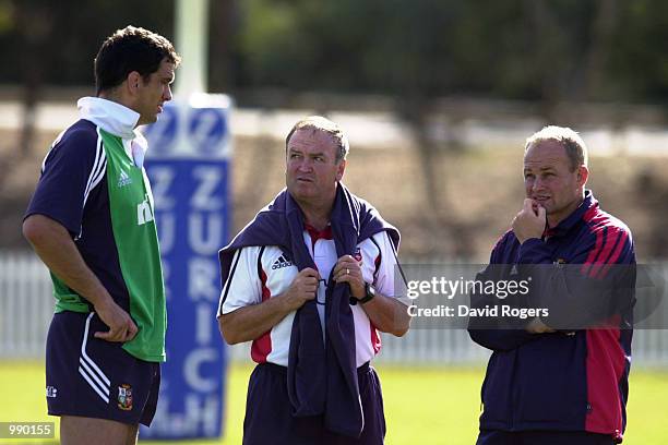 The British Lions management Martin Johnson, , Andy Robinson and Graham Henry, talk tactics during training held at Bruce Stadium in Canberra,...