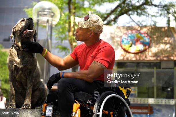 Desert Storm veteran Tony Drees and his service dog Diva, a two year old Italian mastiff, talking and training on the16th St Mall. Drees has...