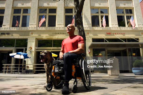 Desert Storm veteran Tony Drees and his service dog Diva, a two year old Italian mastiff, on the16th St Mall. Drees has undergone 74 surgeries since...