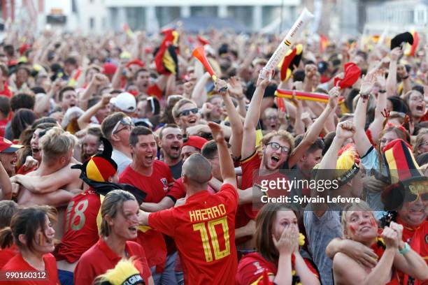 Football fans celebrate winning of Belgian national team after a screen broadcasting of the 2018 FIFA World Cup Russia round of 16 match between...