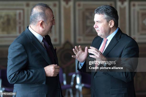 Turkish Minister of Foreign Affairs Mevlüt Cavusoglu and his German counterpart Sigmar Gabriel of the Social Democratic Party converse in the...