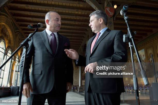 Turkish Minister of Foreign Affairs Mevlüt Cavusoglu and his German counterpart Sigmar Gabriel of the Social Democratic Party converse in the...