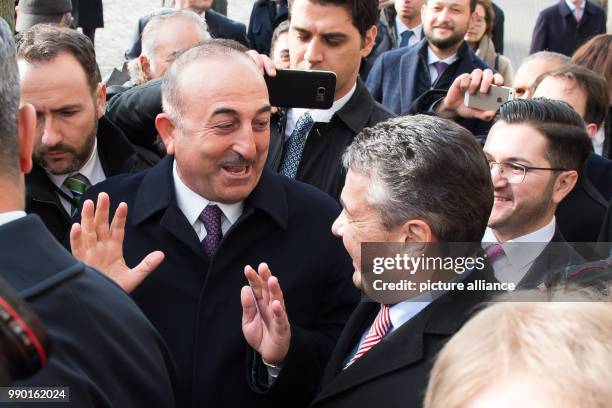German Minister of Foreign Affairs Sigmar Gabriel of the Social Democratic Party walks with his Turkish counterpart in the city of Goslar, Germany, 6...