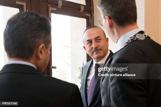 Turkish Minister of Foreign Affairs Mevlüt Cavusoglu talks with with his German counterpart Sigmar Gabriel of the Social Democratic Party and the...