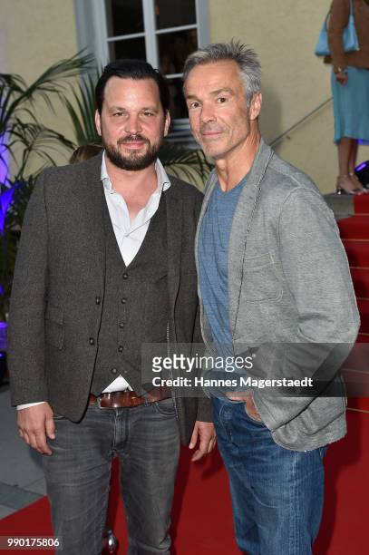 Sascha A. Gersak and Hannes Jaenicke attend the UFA Fiction Reception during the Munich Film Festival 2016 at Cafe Reitschule on July 2, 2018 in...