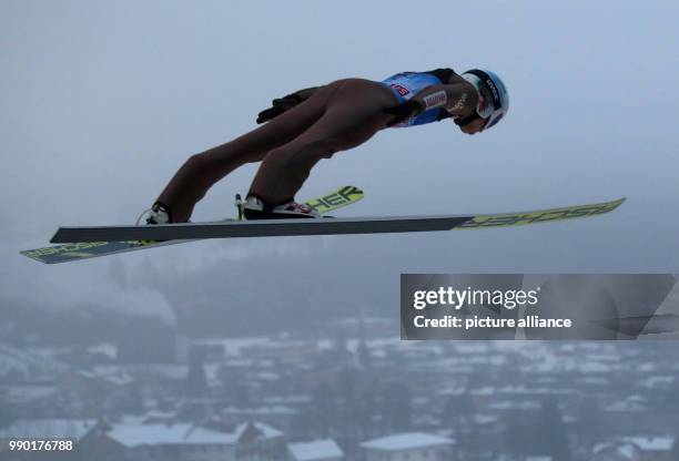 Kamil Stoch from Poland performs his trial jump at the Four Hills Tournament in Bischofshofen, Austria, 6 January 2018. Photo: Daniel Karmann/dpa