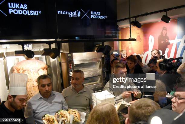 World Cup winner Lukas Podolski signs autographs at the opening of a doner shop in Cologne, Germany, 6 January 2018. Podolski is a co-partner of the...