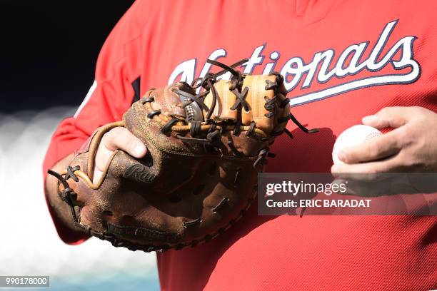 Baseball glove is seen during the batting practice of Washington Nationals baseball players before a game at the Nationals Park on May 21, 2018 in...