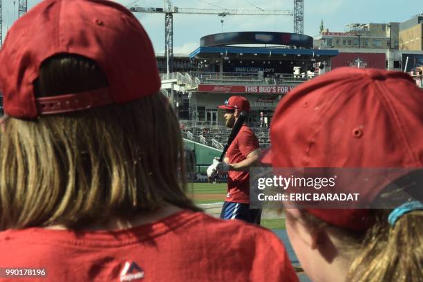 Young fans watch outfielder Bryce Harper during the batting practice of Washington Nationals baseball players before a game at the Nationals Park on...