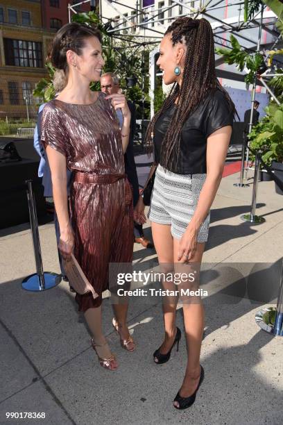 Katrin Wrobel and Francisca Urio attend the Guido Maria Kretschmer show during the Berlin Fashion Week Spring/Summer 2019 at ewerk on July 2, 2018 in...