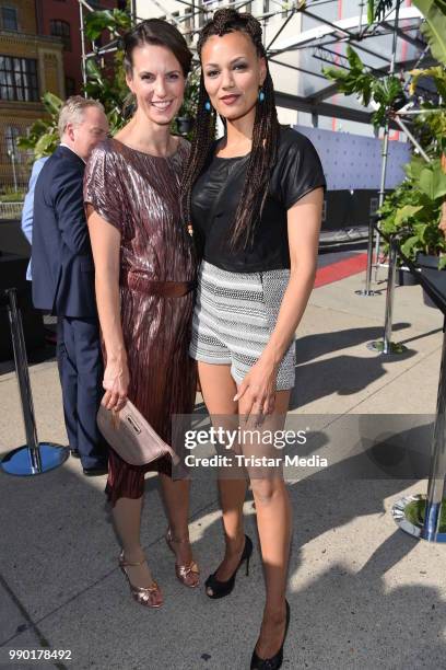 Katrin Wrobel and Francisca Urio attend the Guido Maria Kretschmer show during the Berlin Fashion Week Spring/Summer 2019 at ewerk on July 2, 2018 in...