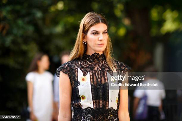 Bianca Brandolini wears a black lace mesh dress, outside Giambattista Valli, during Paris Fashion Week Haute Couture Fall Winter 2018/2019, on July...