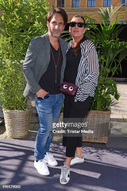 Falk Willy Wild and Katy Karrenbauer attend the Guido Maria Kretschmer show during the Berlin Fashion Week Spring/Summer 2019 at ewerk on July 2,...