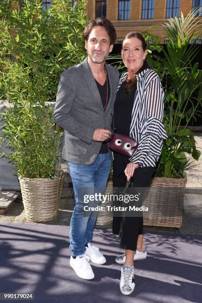 Falk Willy Wild and Katy Karrenbauer attend the Guido Maria Kretschmer show during the Berlin Fashion Week Spring/Summer 2019 at ewerk on July 2,...