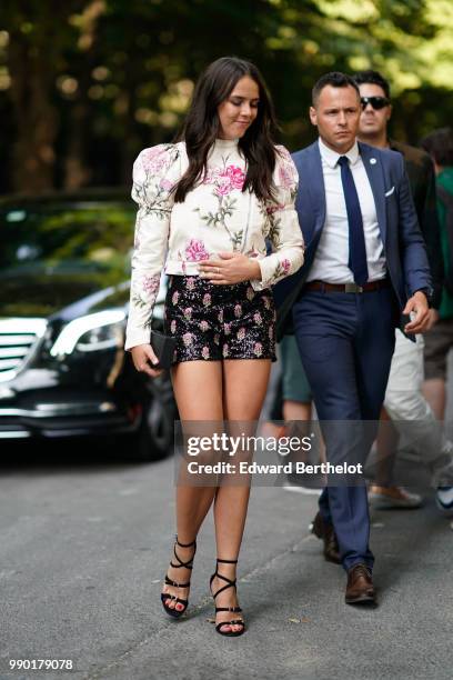 Pauline Ducruet wears a white top with flower prints, black shorts with flowe prrints, black shoes, outside Giambattista Valli, during Paris Fashion...