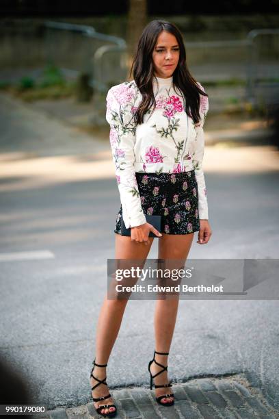 Pauline Ducruet wears a white top with flower prints, black shorts with flowe prrints, black shoes, outside Giambattista Valli, during Paris Fashion...