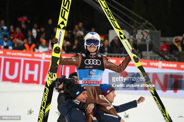 Kamil Stoch of Poland reacts after his jump in the second round at the Four Hills Tournament in Bischofshofen, Austria, 6 January 2018. Stoch won...