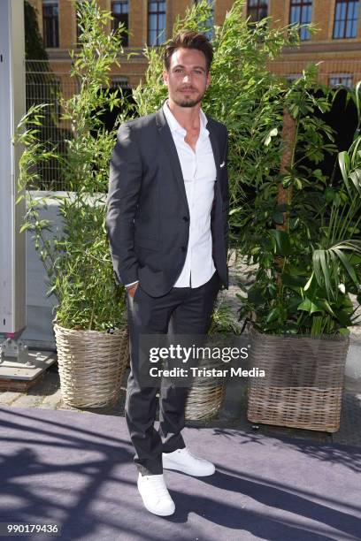 Sebastian Pannek attends the Guido Maria Kretschmer show during the Berlin Fashion Week Spring/Summer 2019 at ewerk on July 2, 2018 in Berlin,...