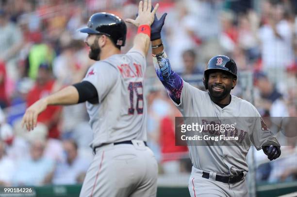 Jackie Bradley Jr. #19 and Mitch Moreland of the Boston Red Sox celebrate after scoring in the second inning against the Boston Red Sox at Nationals...