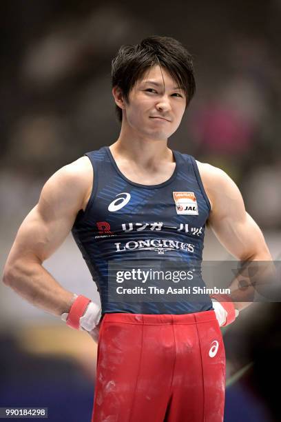 Kohei Uchimura reacts after falling while competing in the Men's Horizontal Bar on day one of the 72nd All Japan Artistic Gymnastics Apparatus...